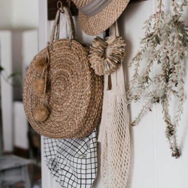 Cozy arrangement of straw hats and bags, perfect for rustic decor inspiration.